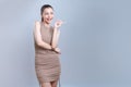 Glamorous beautiful asian woman making finger pointing in isolated background.