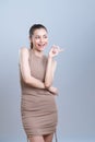 Glamorous beautiful asian woman making finger pointing in isolated background.