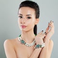 Glamorous Beauty. Cute Woman with Evening Makeup and Jewelry