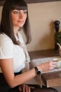 Glamorous brunette in a cafe Royalty Free Stock Photo