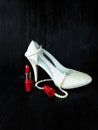 Glamorous composition made of white heels, red lipstick and pearl necklace Royalty Free Stock Photo