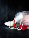 Glamorous composition made of white heels, red lipstick and pink dress Royalty Free Stock Photo