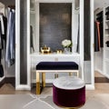 A glamorous dressing room with a vanity mirror, a plush velvet ottoman, and a walk-in closet showcasing designer fashion and acc