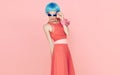 Glamorous fashion lady in blue wig and sunglasses