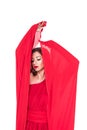 glamorous girl posing in red dress with veil Royalty Free Stock Photo