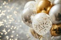 Glamorous gold and white balloons with confetti details against twinkling light background, perfect for sophisticated Royalty Free Stock Photo