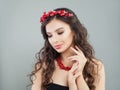 Glamorous jewelry model brunette. Pretty young woman with makeup, long hair and coral necklace