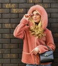 Glamorous lady. Fashion as unique as you are. Pink sheepskin coat. Fancy chic coat. Natural wool sheepskin coat. Fur on