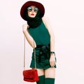 Glamorous lady in vintage trend accessories. Green and red combination in clothing Royalty Free Stock Photo