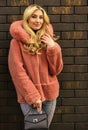 Glamorous lady. Woman wear furry coat. Winter clothes. Fashion as unique as you are. Pink sheepskin coat. Fancy chic