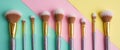 Glamorous makeup brushes arranged on a vibrant pastel background Royalty Free Stock Photo