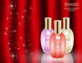 Glamorous perfume glass bottles on the sparkling silky background.