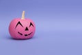 Glamorous pink pumpkin for Halloween on a purple background