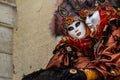 Glamorous and romantic couple with beautiful eyes and venetian mask during venice carnival