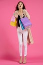 glamorous woman attractive look shopping smile summer style pink background Royalty Free Stock Photo