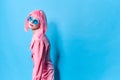 glamorous woman in blue glasses wears a pink wig isolated background Royalty Free Stock Photo