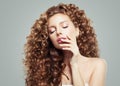 Glamorous woman fashion model portrait. Beautiful girl with long curly hair Royalty Free Stock Photo