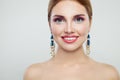 Glamorous woman fashion portrait. Cute girl with colorful makeup and gold earrings. Royalty Free Stock Photo