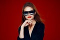 glamorous woman wearing sunglasses red lips posing close-up Royalty Free Stock Photo