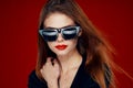 glamorous woman wearing sunglasses red lips posing close-up Royalty Free Stock Photo