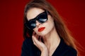 glamorous woman wearing sunglasses red lips posing close-up Royalty Free Stock Photo