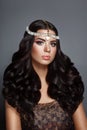 Glamour beauty woman brunette with beautiful shiny gourgeous perfect curly hair and makeup Royalty Free Stock Photo