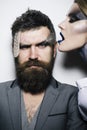 Glamour concept. Bearded man and woman with glamour makeup and hairstyle. Couple in love with glamour look. Glamour