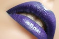 Glamour Gloss Lip Make-up. Fashion Makeup Beauty Shot. Close-up full Lips with celebrate Purple Lipgloss