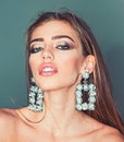 Glamour jewelry of luxury big earrings. Girl with lips makeup. Fashion model with trendy look. Beauty on party. My