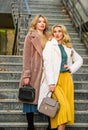 Glamour models look luxuriously. sexy blong women. autumn season. modern life. european winter. girls warm coat on Royalty Free Stock Photo