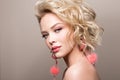 Glamour portrait of beautiful girl model with makeup and romantic wavy hairstyle. Royalty Free Stock Photo