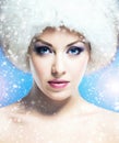 Glamour portrait of a young and beautiful woman in a winter hat Royalty Free Stock Photo