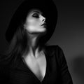 Glamour makeup woman profile posing in fashion hat on dark Royalty Free Stock Photo