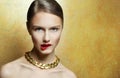 Glamour young woman with perfect make up with golden neckla Royalty Free Stock Photo