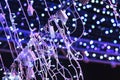 Glamour Ultra Violet sparkling and purple glitter bokeh. Multicolored Christmas and New Year glowing light abstract bokeh and Royalty Free Stock Photo