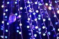 Glamour Ultra Violet sparkling and purple glitter bokeh. Multicolored Christmas and New Year glowing light abstract bokeh and Royalty Free Stock Photo