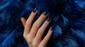 Glamour woman hand with luxury navy color nail polish manicure on fingers