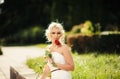 glamour woman with a red rose. Outdoor summer picture Royalty Free Stock Photo