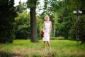 glamour woman with a red rose. Outdoor summer picture Royalty Free Stock Photo