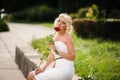 glamour woman with a red rose. Outdoor summer picture Royalty Free Stock Photo