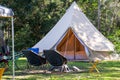 Glamping camping teepee tent and chairs at the campsite