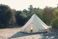 Glamping campsite in the forest. Big camping tent for luxury outdoor vacation. Staycations, hyper-local travel, night camping out