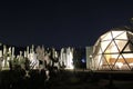Glamping Geodesic Dome luxury camping tent amid cactus night view Royalty Free Stock Photo