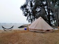Glamping tent and hammock by the beach