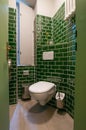 Glance into an extraordinary guest toilet. with wall-hung toilet, which was attached over a corn