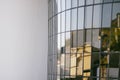 A glare-curving window consisting of small rectangular panes of glass on the right side and a blank wall on the left side
