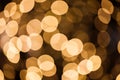 Glare from yellow lights in out-of-focus, oval glowing light, background. Bokeh effect Royalty Free Stock Photo