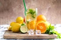 Glas with lemonade or mojito cocktail with lemon and mint, cold refreshing drink or beverage with ice Royalty Free Stock Photo