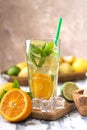 Glas with lemonade or mojito cocktail with lemon and mint, cold refreshing drink or beverage with ice Royalty Free Stock Photo