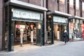 Exterior entrance to New Look fashion clothing store showing doors, logo and branding